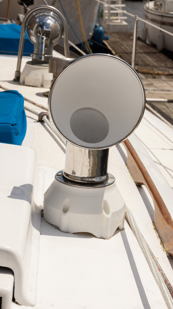 Photos showing different views of a boat Dorade mount.